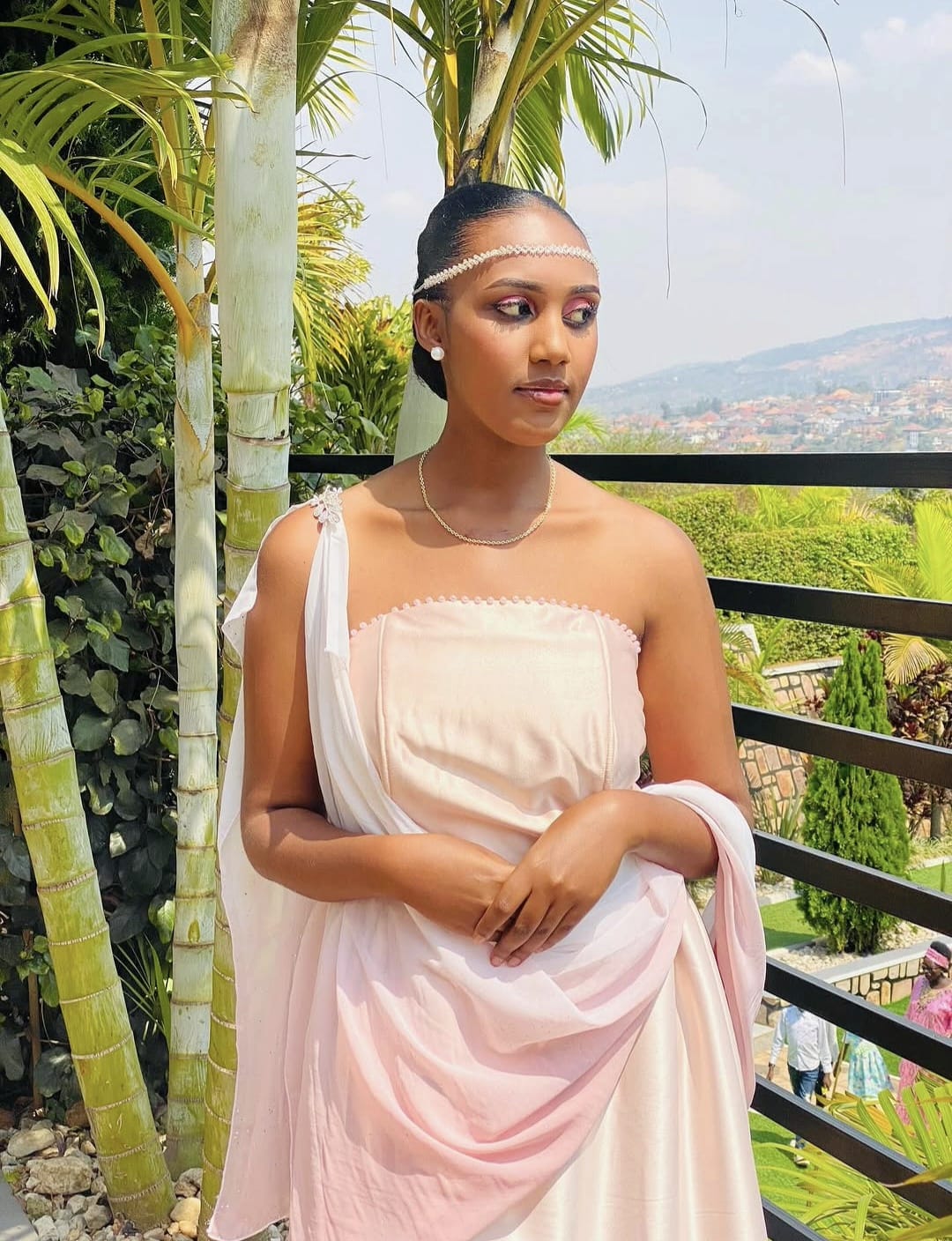 Sabine, founder of La Kuzwe, wearing a blush mushanana.